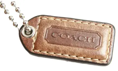 Close up of a Coach purse leather tag